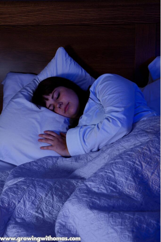 a-woman-in-her-bedroom-ready-to-sleep-on-evening-habits-that-help-you-relax