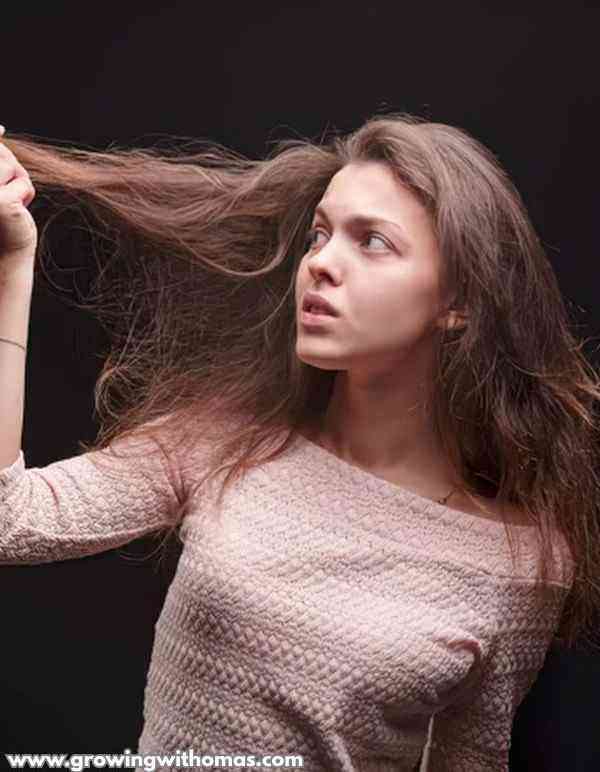 woman-worried-of-her-hair-stands-broken-on-common-mistakes-that-cause-hair-damage
