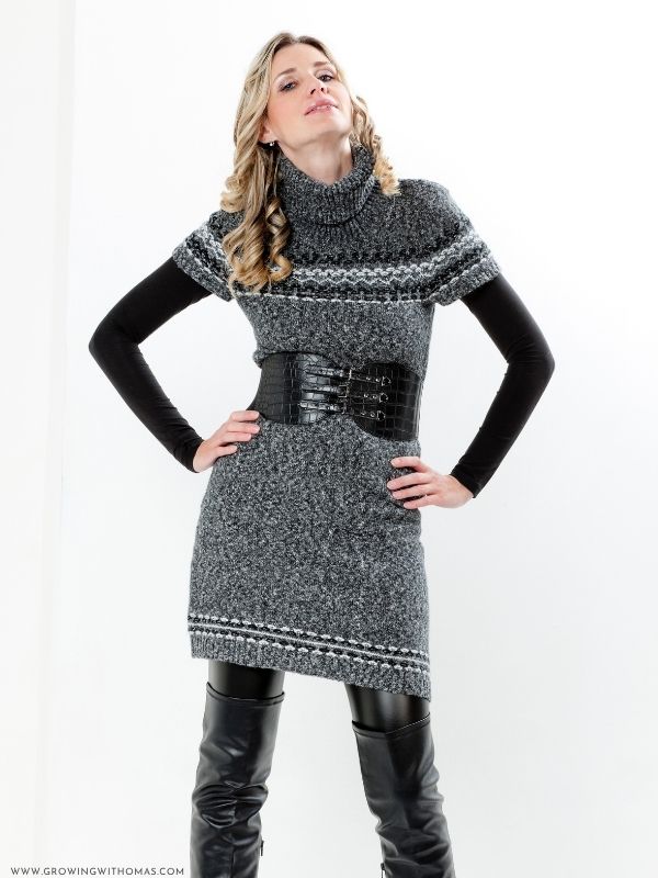 Elegant-woman-wearing-a-neutral-turtleneck-midi-dress-with-boots