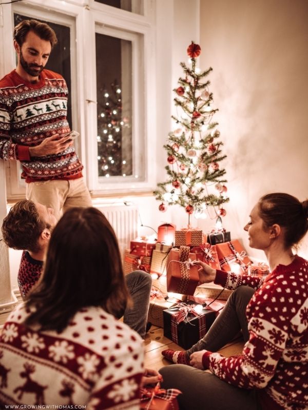 Friends-exchanging-wrapped-Christmas-gifts-during-a-holiday-party