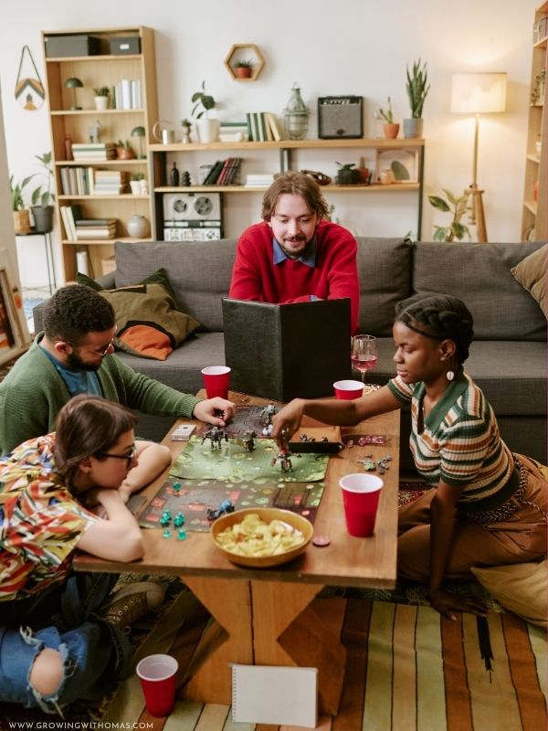 Group-of-adults-playing-a-fun-Christmas-game-at-a-holiday-party