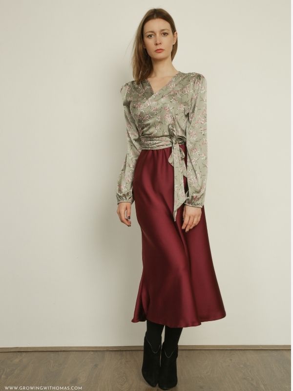 Woman-wearing-a-satin-midi-skirt-with-a-simple-blouse