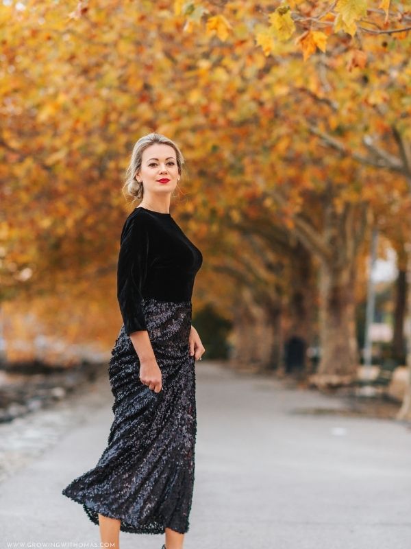 Woman-wearing-an-elegant-black-and-grey-winter-dress