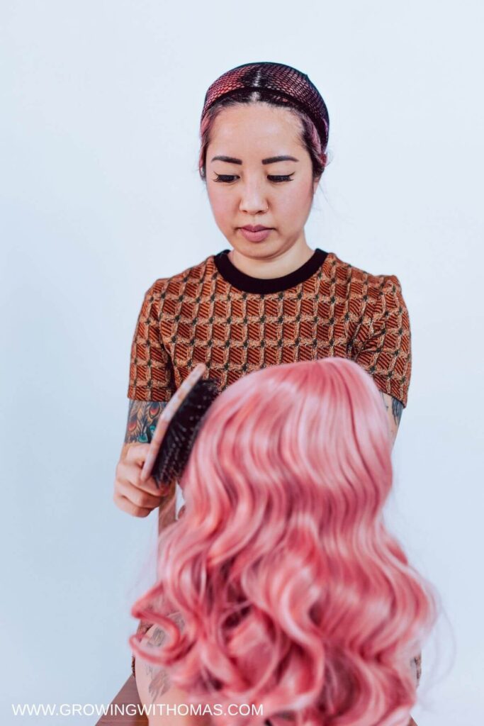 a-lady-brushing-her-wig