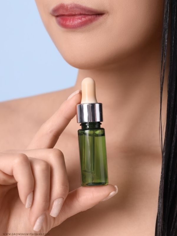 woman-holding-a-bottle-of-oil