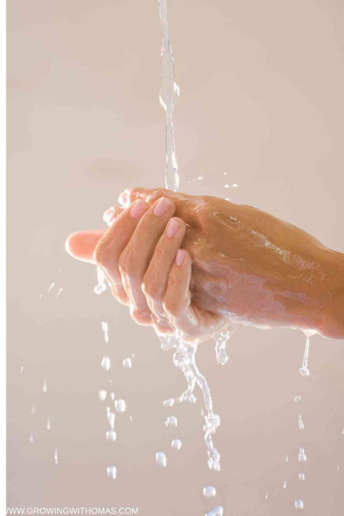 someone-washing-hands-with-lukewarm-water