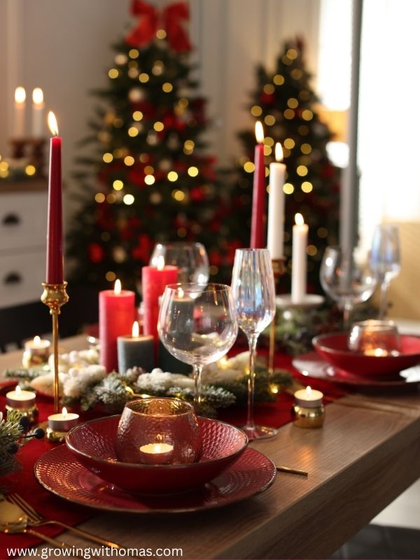 A-Christmas-dining-table-with-a-simple-festive-centerpiece-candles-greenery-and-elegant-place-settings