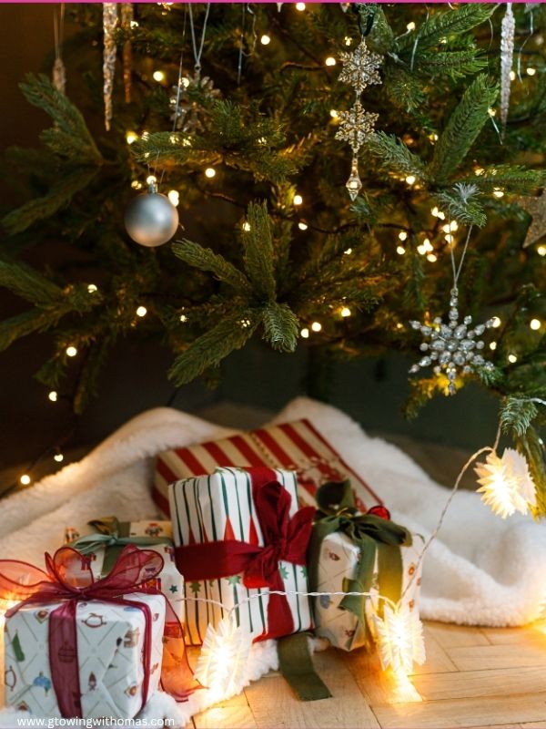 A-cozy-Christmas-corner-with-a-small-tree-candles-wrapped-gifts-and-warm-lighting-in-must-see-christmas-decoration-ideas