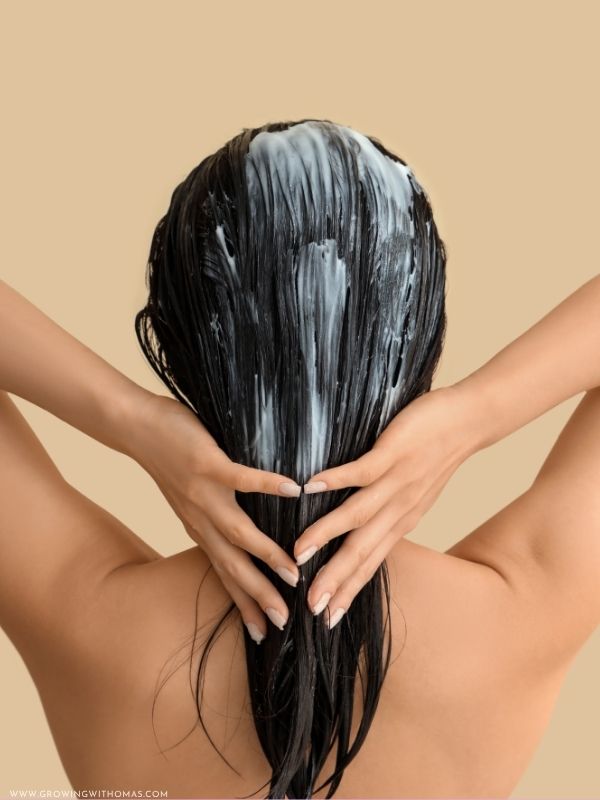 Applying-a-deep-conditioner-during-wash-day.