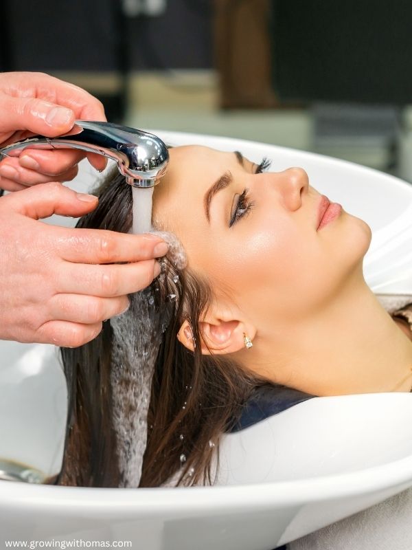 woman-happily-washing-her-hair-in-Choose- the-right-shampoo-for-your-hair-type