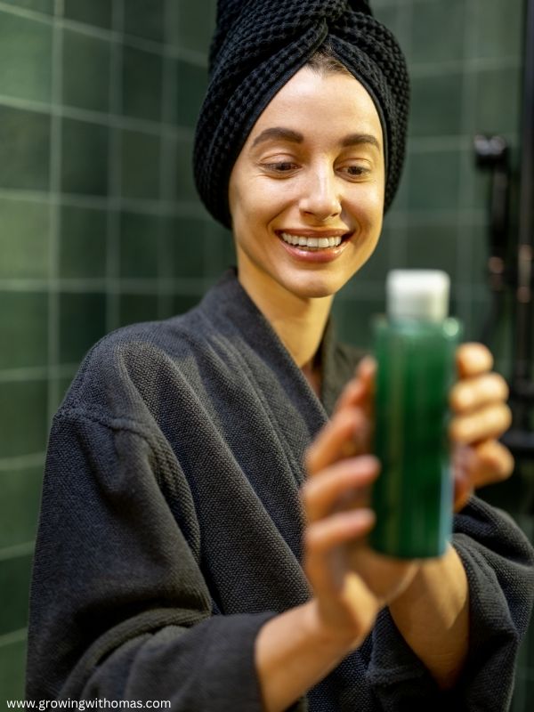 woman-holding-a-shampoo-happily-in-Choose-the-right-shampoo-for-your-hair-type